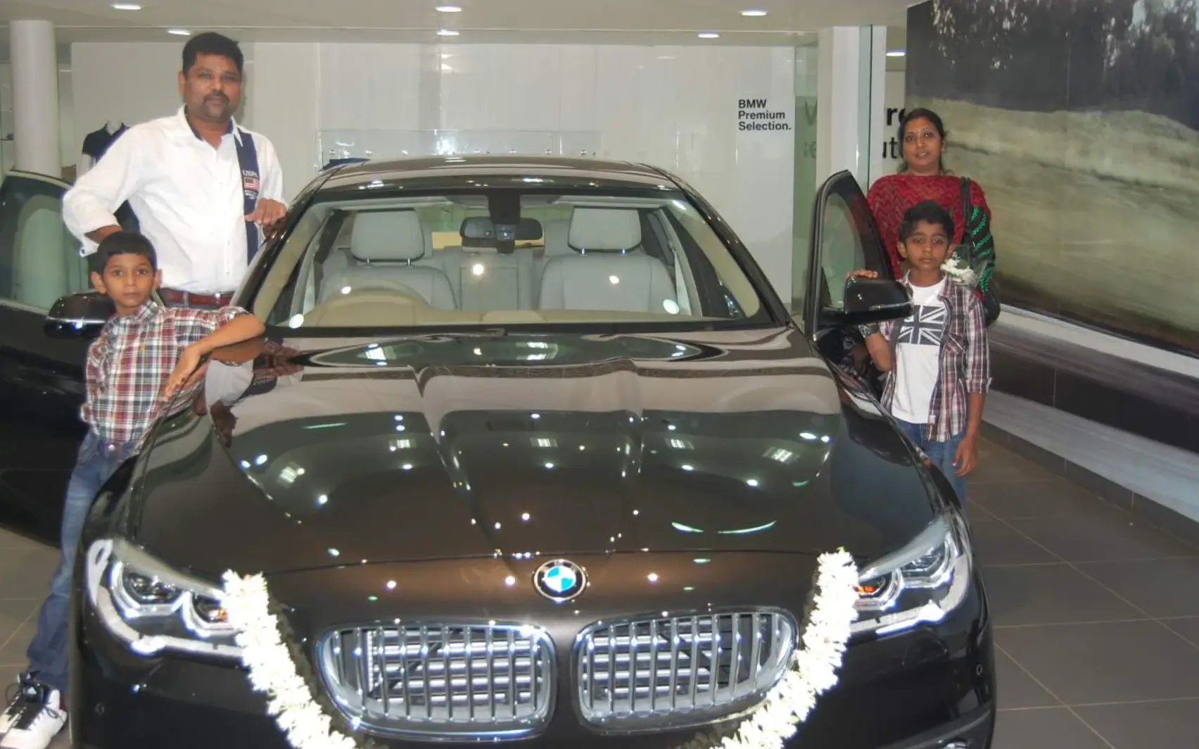 Girish and family with their new BMW 5 Series